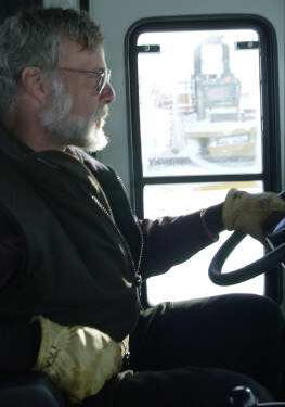 Project leader John Wright driving tractor