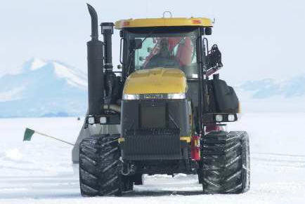 Russ Magsig driving a Challenger pulling fuel tanks