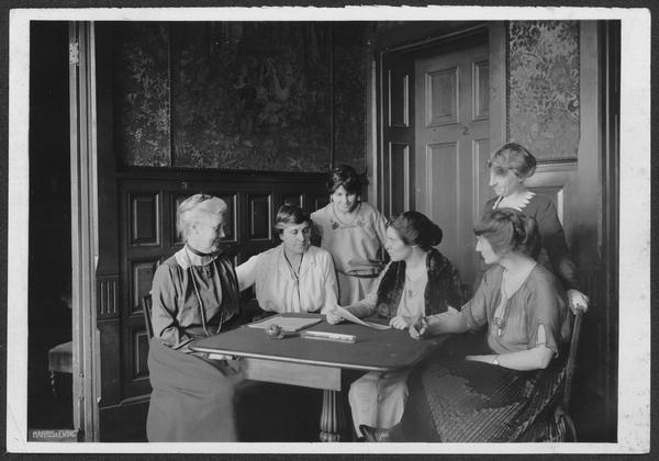 Suffragettes conferring over ratification of 19th Amendment